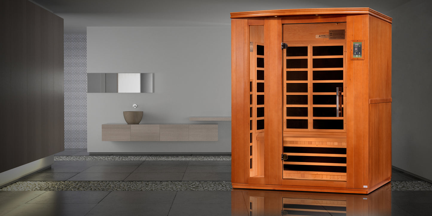 3-person sauna made of natural hemlock wood. Exterior dimensions: 60" W x 45" D x 75" H (roof overhang adds 4.3"). Interior dimensions: 57" W x 41" D x 69" H. Includes Bluetooth music system with two speakers (no radio), LED control panels inside and out.
Features 9 Carbon PureTech™ Ultra Low EMF heating panels, a tempered glass door, interior chromotherapy lighting (red light therapy starting in 2024). Roof vent for airflow. 120V/20amp (consult an electrician). Clasp-together assembly.Model: DYN-6336-02