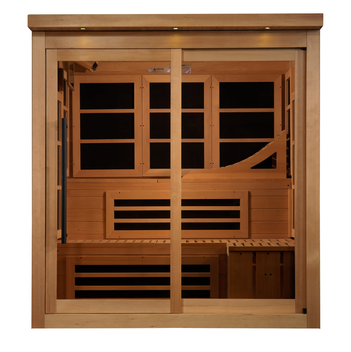 Sauna_And_Plunge_Direct-Golden Designs Inc-New Model GDI-6996-02.
6-Person Capacity
Exterior: 73" x 61" x 75" (6" roof overhang)
Interior: 68" x 57" x 72"
FM/CD radio, MP3, 4 speakers, 15” LCD monitor/DVD (smart screen needs Firestick)
Lighting: Chromotherapy + Red Light (2024 feature), exterior accent lighting
 LED panel,
 Hemlock wood (natural finish)
 2x 20-amp outlets/breakers (electrician recommended)
 16 Carbon PureTech™ Near 
Zero EMF panels
 Tempered glass door, roof vent
Weight: 750 lbs