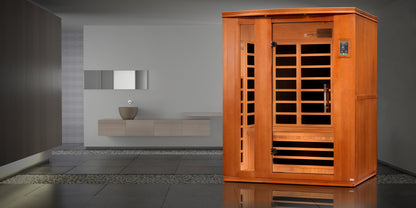 3-person sauna made of natural hemlock wood. Exterior dimensions: 60" W x 45" D x 75" H (roof overhang adds 4.3"). Interior dimensions: 57" W x 41" D x 69" H. Includes Bluetooth music system with two speakers (no radio), LED control panels inside and out.

Features 9 Carbon PureTech™ Ultra Low EMF heating panels, a tempered glass door,  interior chromotherapy lighting (red light therapy starting in 2024). Roof vent for airflow. 120V/20amp (consult an electrician). Clasp-together assembly.Model: DYN-6336-02 