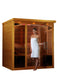 DYNAMIC Ultra Low EMF Far Infrared Indoor Sauna (DYN-6996-01 Elite), designed for 6-person use. Features natural finish hemlock wood construction, 15 Carbon PureTech Ultra Low EMF heat emitters, FM/CD radio with MP3 auxiliary, 15” LCD monitor with DVD player, oversized interior chromotherapy lighting, and tempered glass door. Dimensions: exterior 73"x61"x79", interior 68"x57"x72". Electrical service: 2 dedicated 20 amp 120V outlets. Clasp together assembly. Sauna weight: 750 lbs., shipping weight: 835 lbs.,